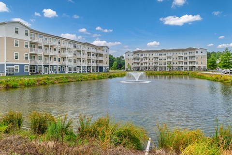 A large building with a fountain in front of it.