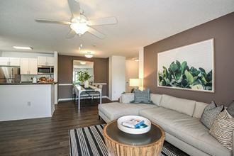 Living Room With Kitchen at Champions Walk Apartment Homes, Bradenton, FL