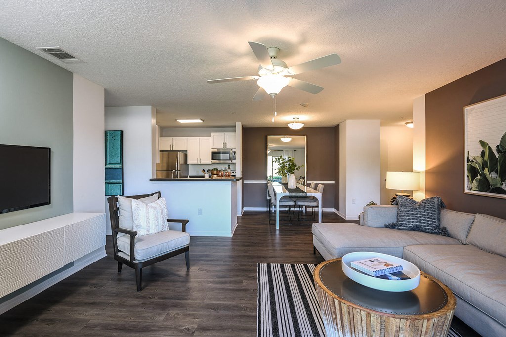 Living Room With TV at Champions Walk Apartment Homes, Florida, 34210