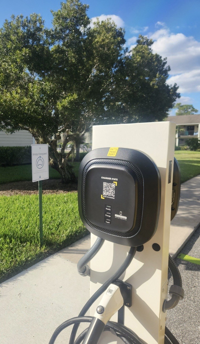 a parking meter on the side of a sidewalk at The Fountains at Deerwood, Jacksonville, FL, 32256