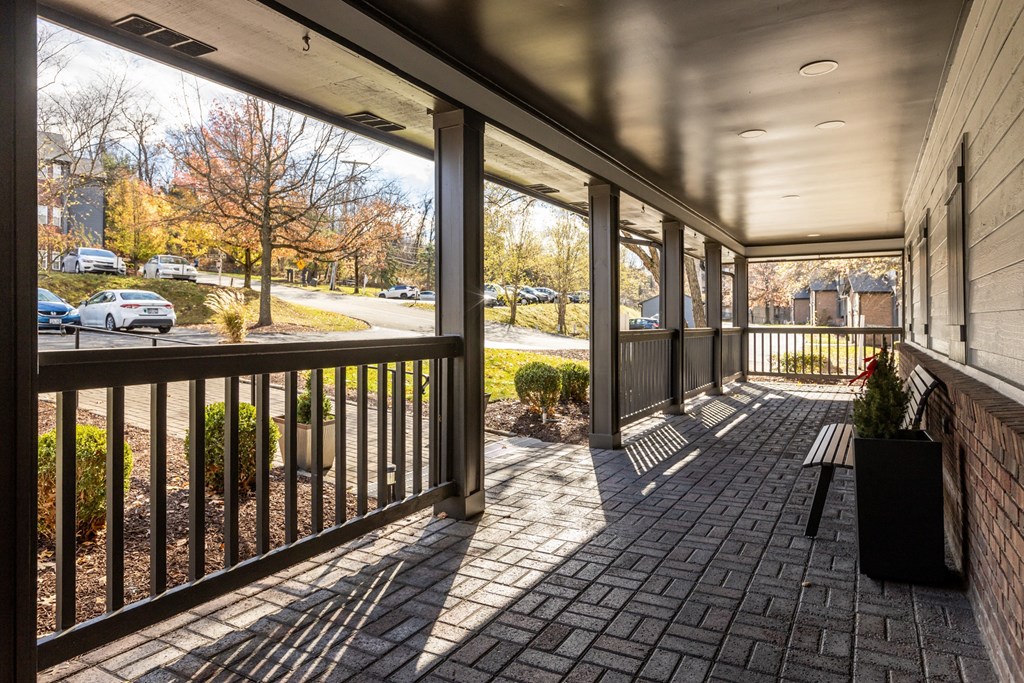 A balcony with a black railing and a planter box. at Eagle Ridge Apartments, Monroeville, 15146