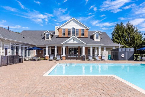 A large house with a pool in the backyard.