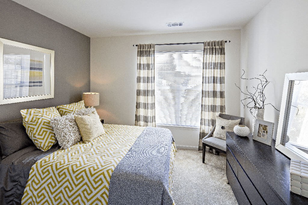 a bedroom with a bed and a window a bedroom with a bed and a window at Merion Stratford Apartment Homes, Stratford, CT