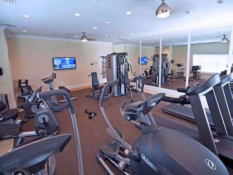 Fitness room with workout equipment and TV  at Barclay Glen Apartments, New Jersey