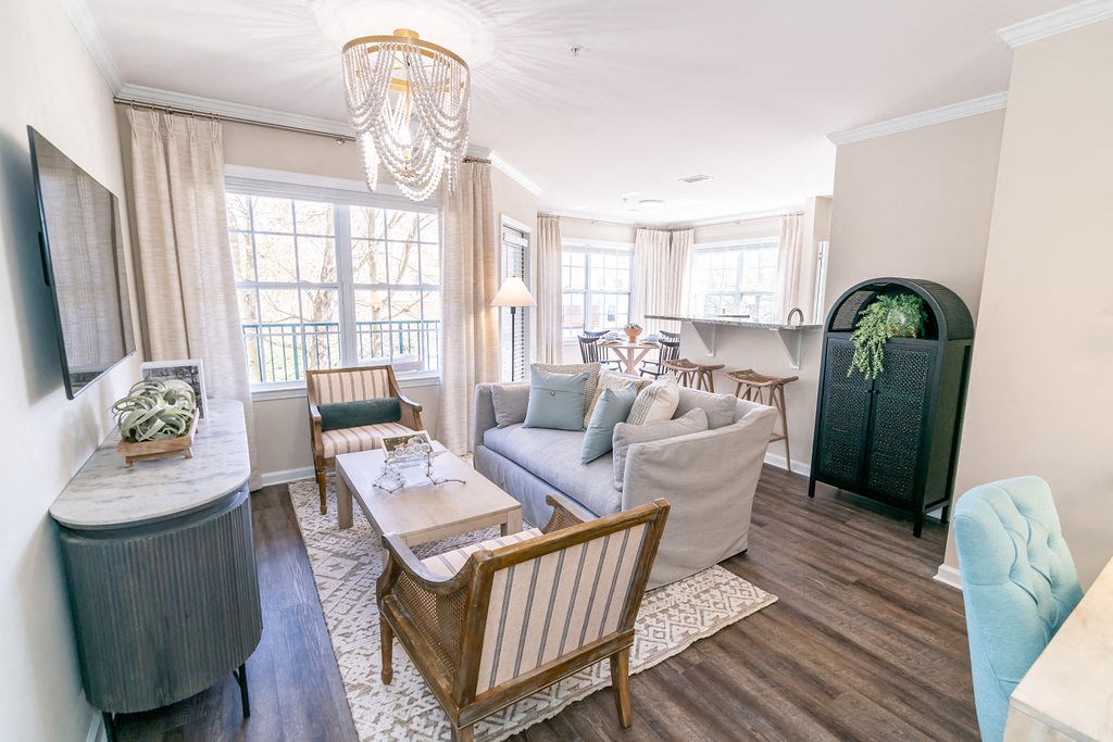 a living room with a couch and a table at The Ledges Apartment Homes, Groton, CT, 06340
