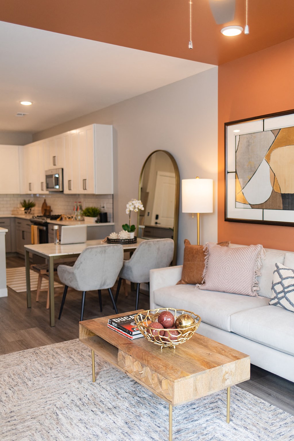 a living room and dining room with a couch and a table at The Yards at Malvern, Malvern, PA