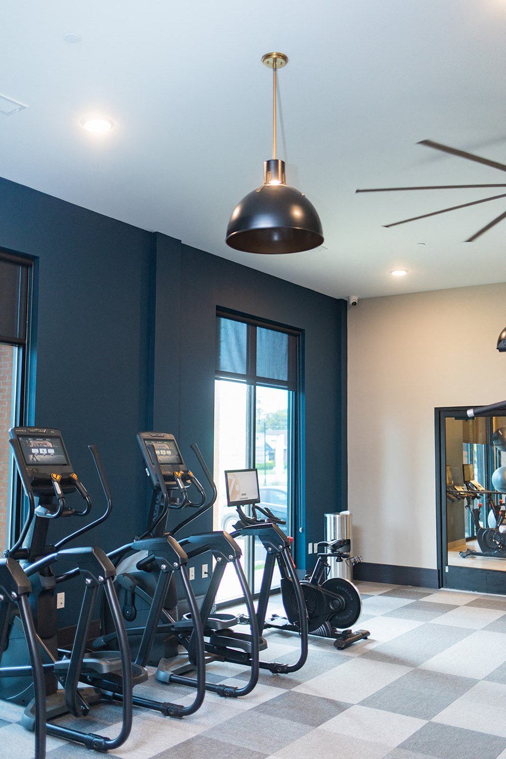 a fitness room with exercise bikes and a ceiling light at The Yards at Malvern, Malvern, PA