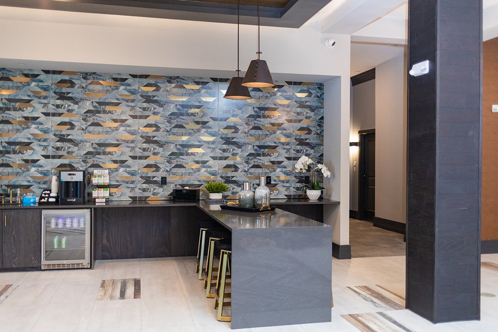 a kitchen with a marble counter and a fish wallpaper on the wall at The Yards at Malvern, Malvern, PA