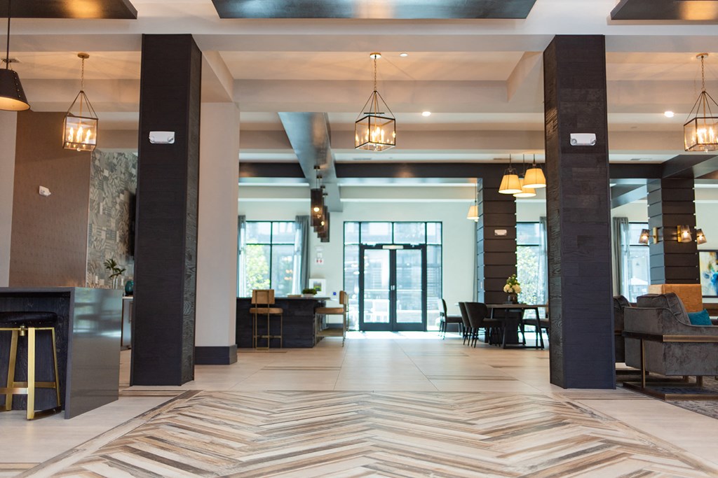 the lobby of a hotel with a marble floor and a fireplace at The Yards at Malvern, Malvern, PA