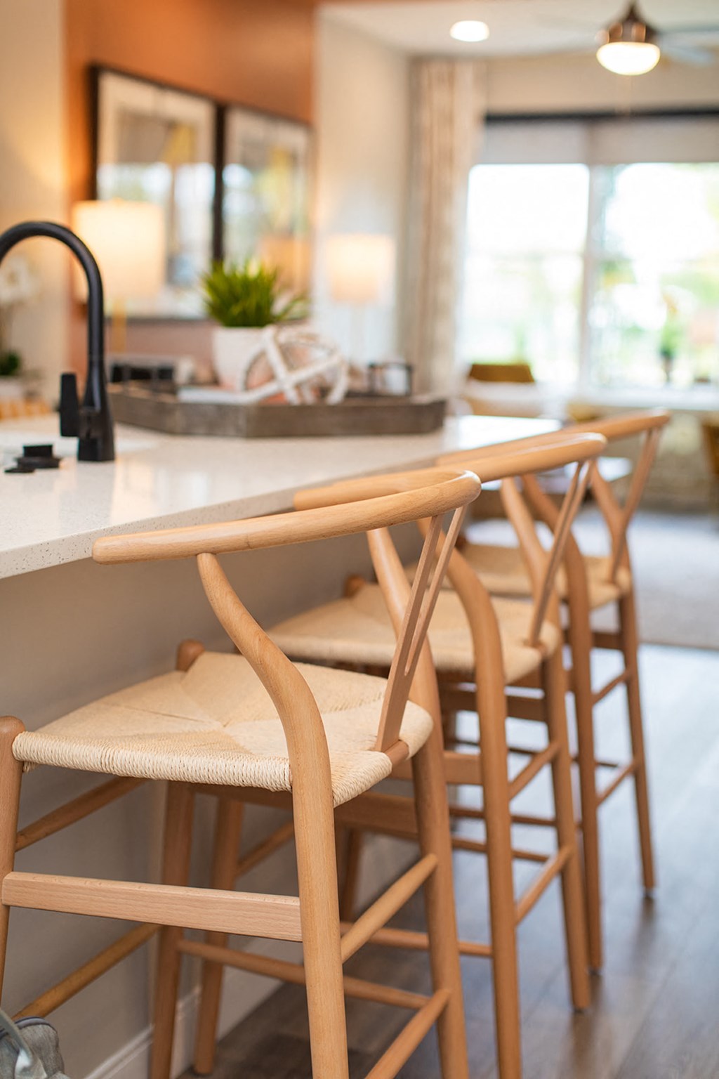 a row of wooden bar stools at a kitchen counter at The Yards at Malvern, Malvern, PA