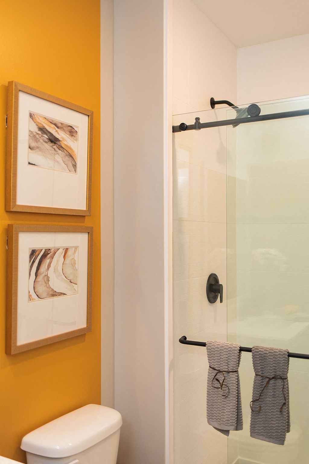 a bathroom with a toilet and a glass shower at The Yards at Malvern, Malvern, PA