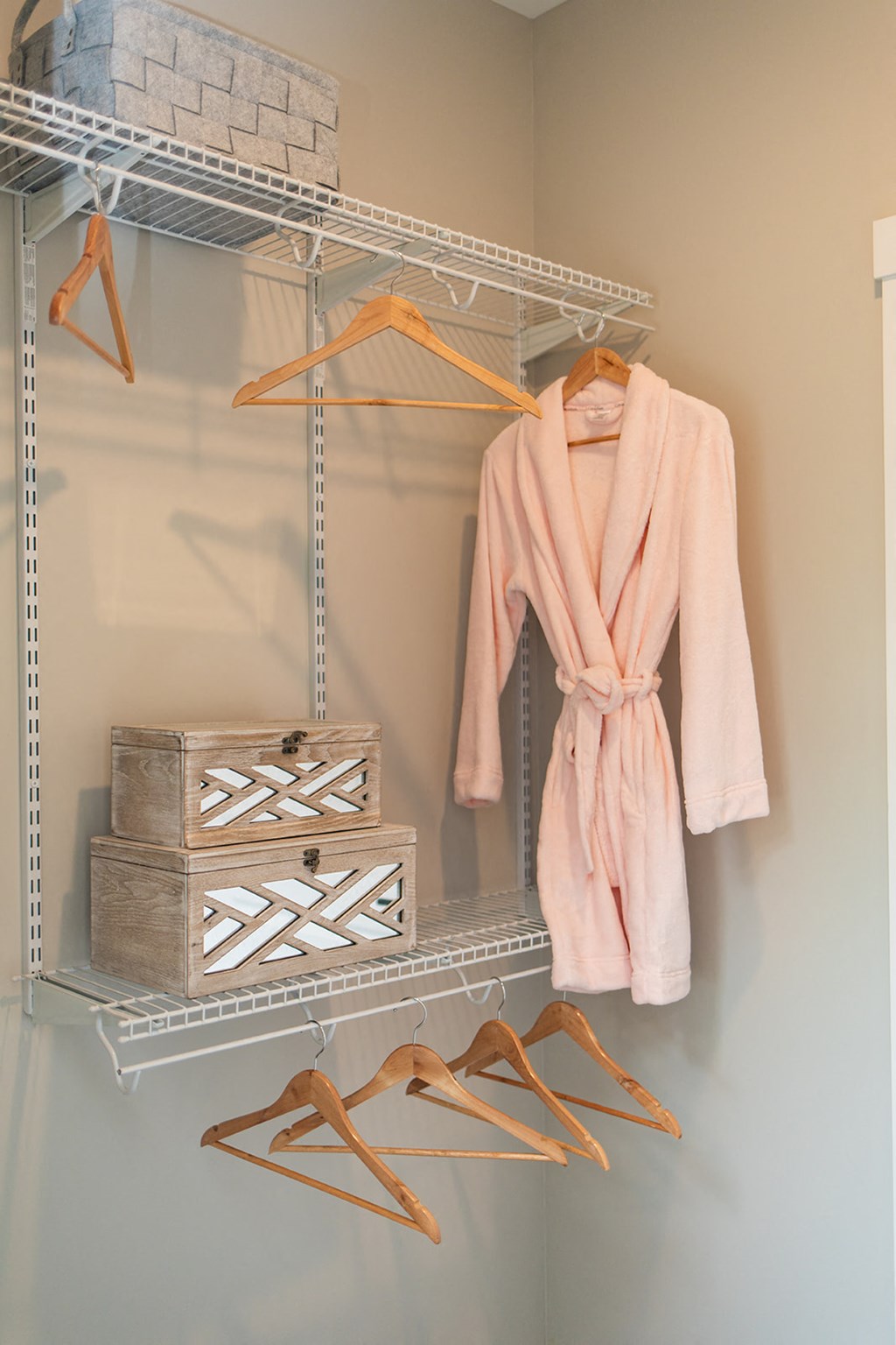 a rack with a robe and shoes on it in a closet at The Yards at Malvern, Malvern, PA