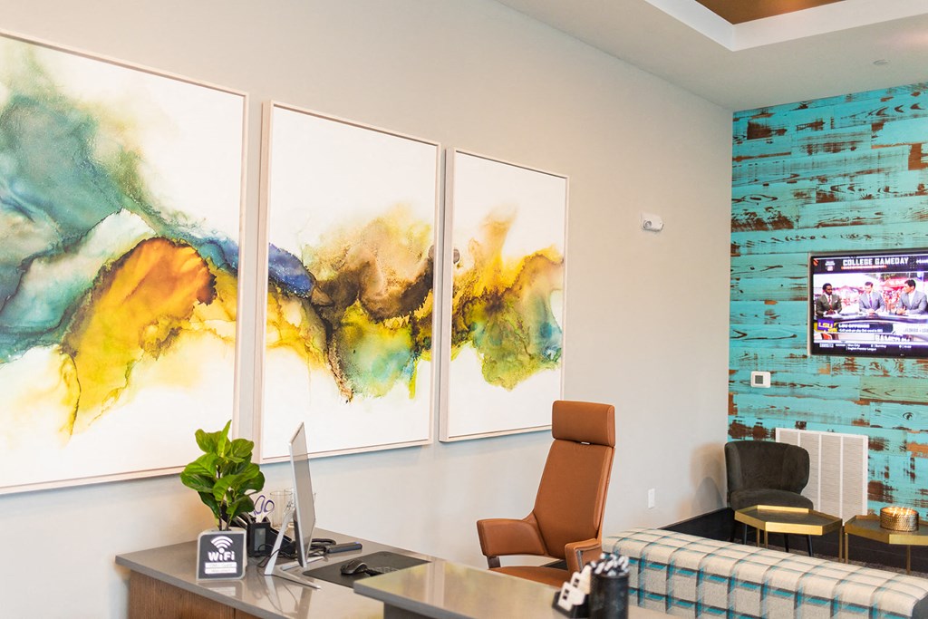 three paintings hanging on a wall in an office at The Yards at Malvern, Malvern, PA