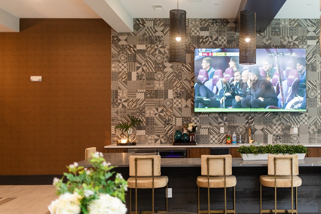 the lobby with a bar and a tv on the wall at The Yards at Malvern, Malvern, PA