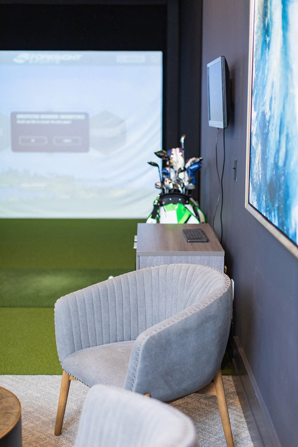 a chair in front of a projector screen in a room at The Yards at Malvern, Malvern, PA