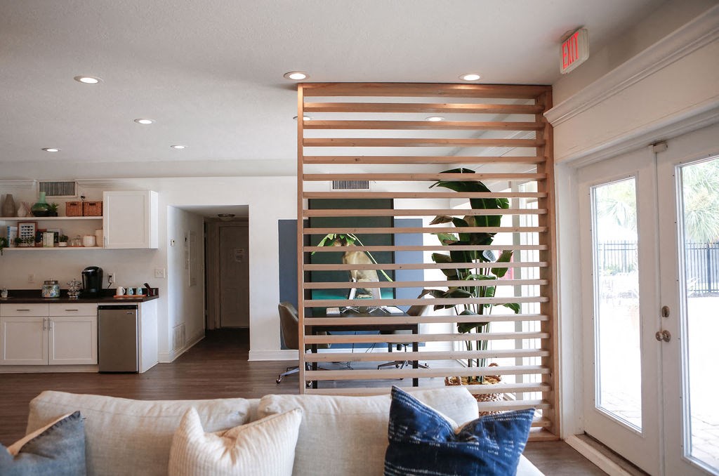 a spiral staircase divides the living room from the kitchen  at The Villas at Flagler Pointe, Saint Petersburg, FL