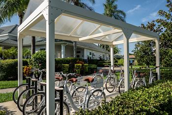a group of bikes parked in front of a white pavilion at Champions Walk Apartment Homes, Bradenton, Florida