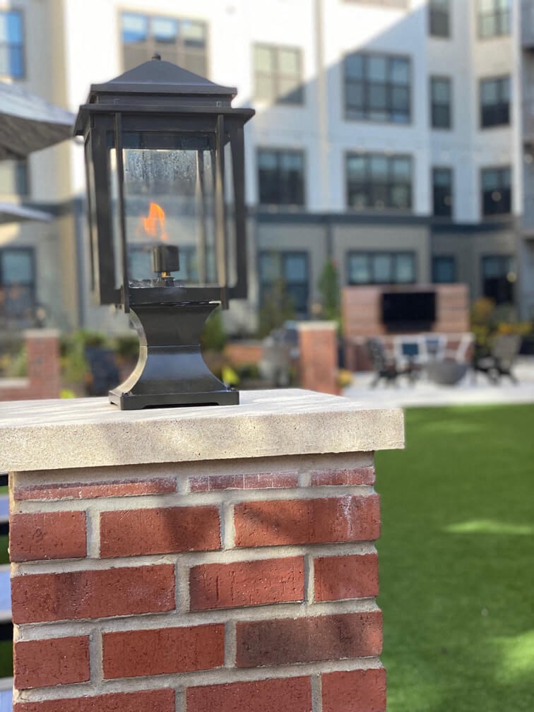 a light on the side of a brick wall at The Yards at Malvern, Malvern, Pennsylvania