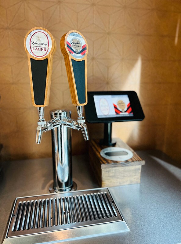 a bar with two beer taps and a sink at The Yards at Malvern, Malvern