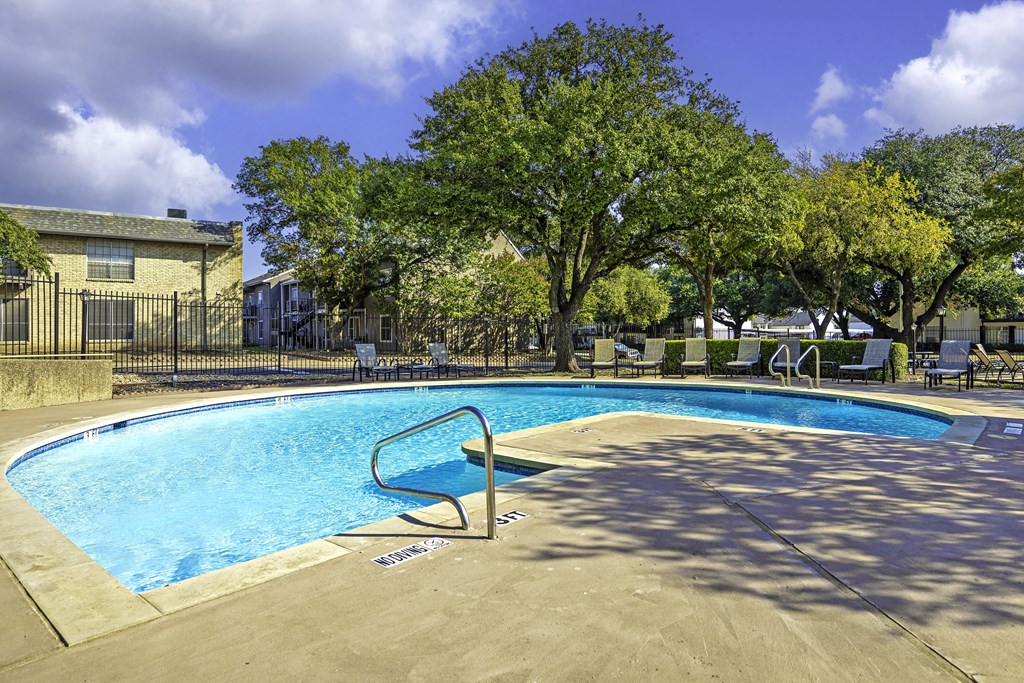 our apartments have a resort style swimming pool with trees