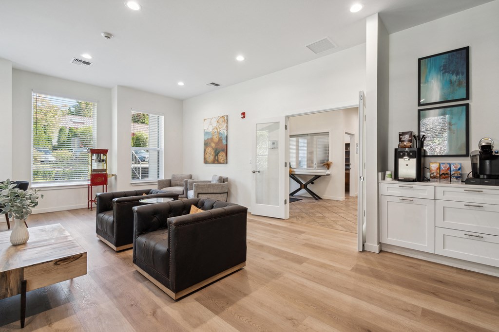 a living room with two leather couches and a coffee table