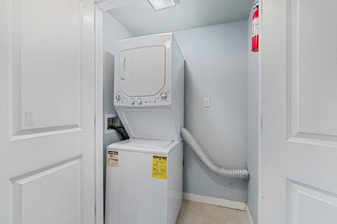 the laundry room has a washer and dryer in it