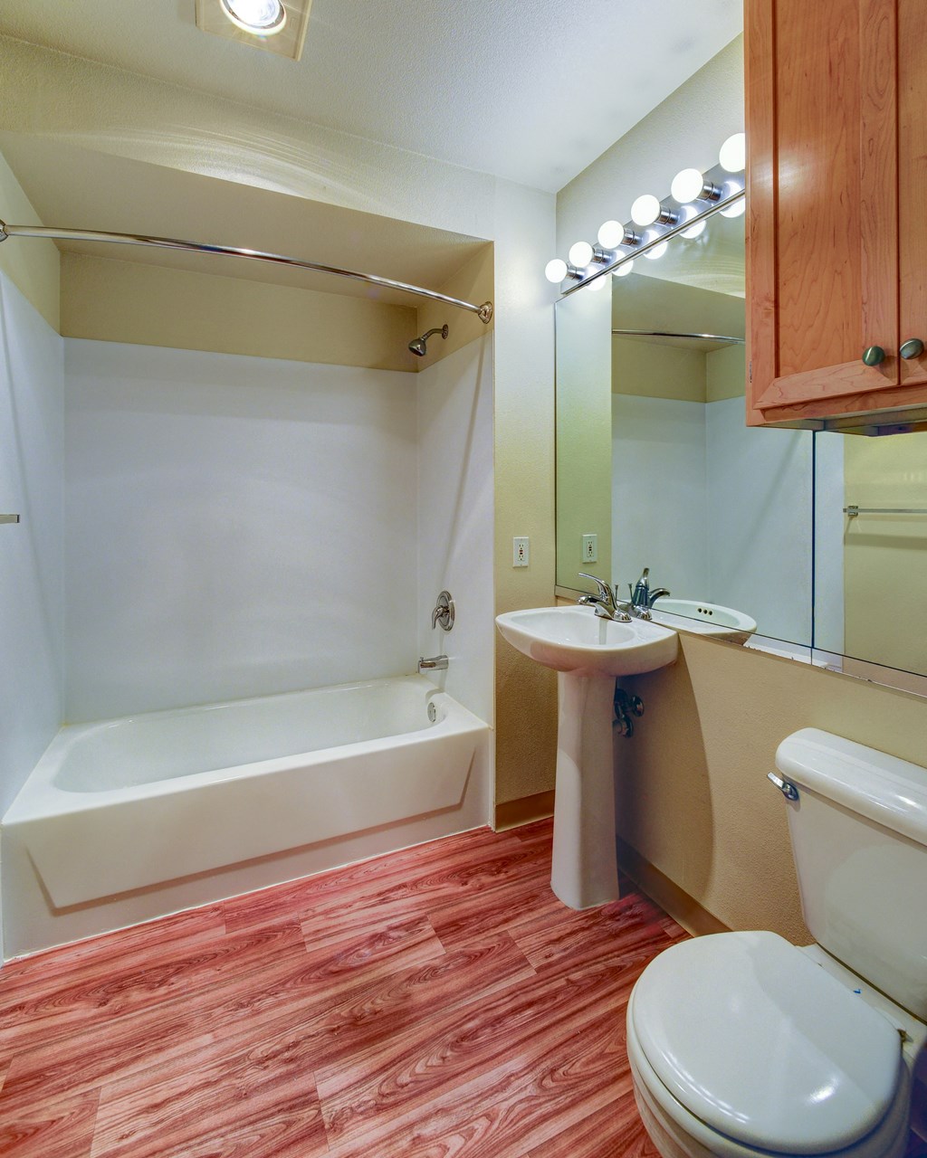 a bathroom with a toilet sink and a bath tub