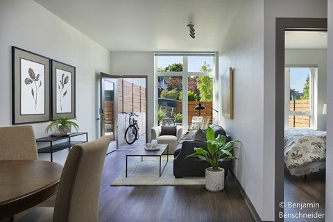 a view of the living room and bedroom from the dining room