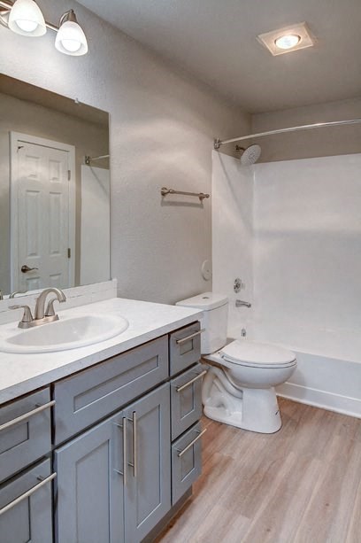 a bathroom with a toilet and a sink and a mirror