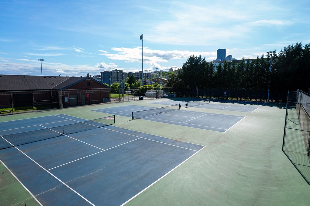 a group of tennis courts on top of a building