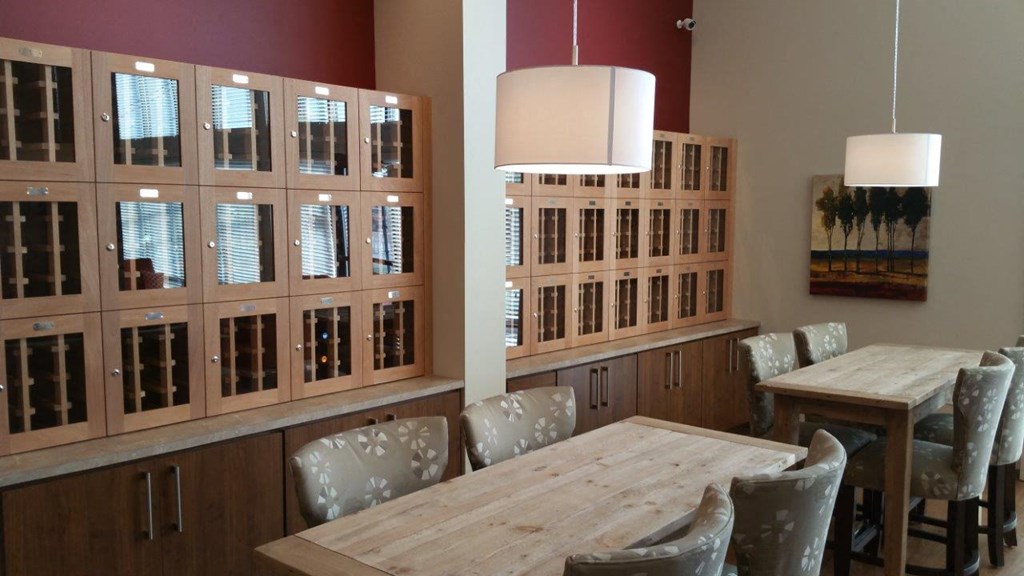 a dining room with a wooden table and chairs