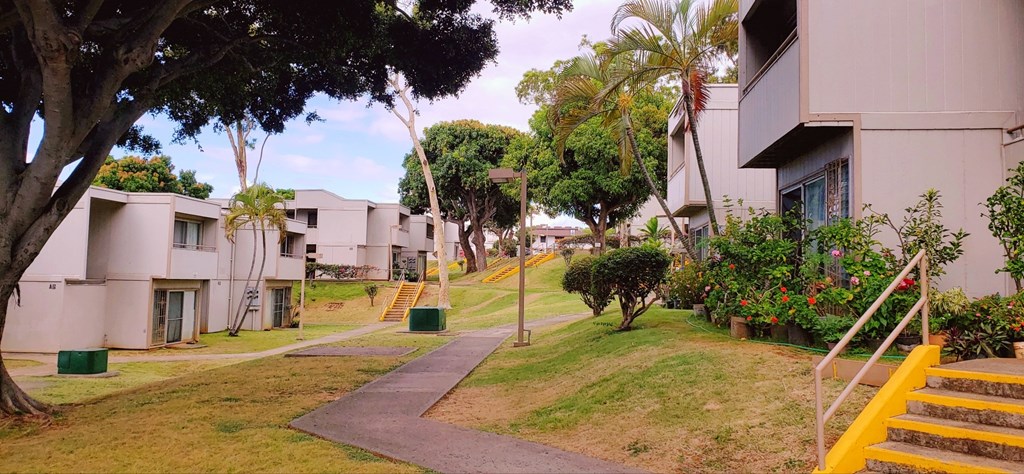 a view of the pathway between the apartment buildings