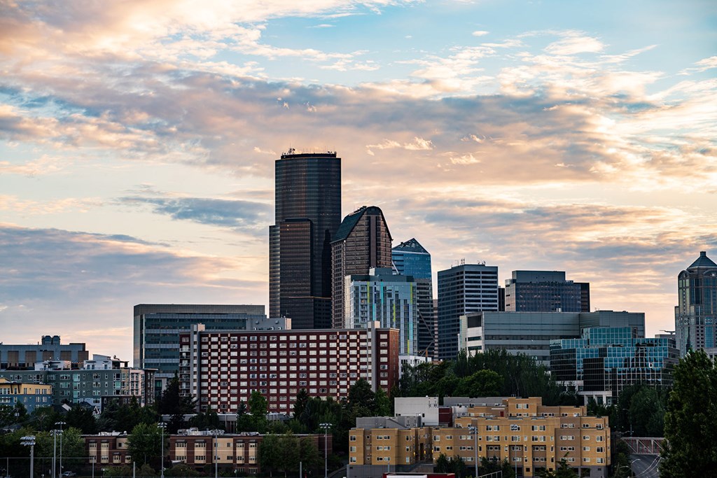 the skyline of the city at sunset