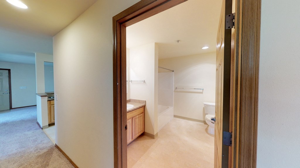 a view of a bathroom from the entrance of a house
