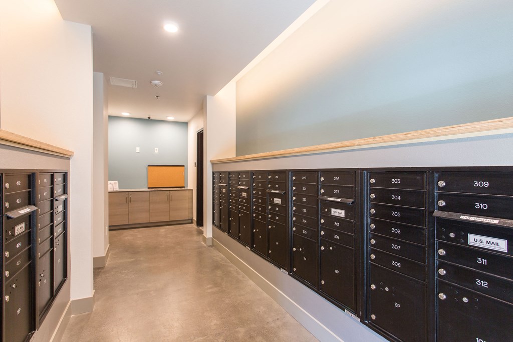 a locker room with a bunch of mailboxes in it