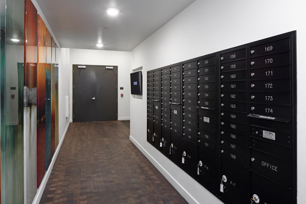 a lockers room in a building with a black door