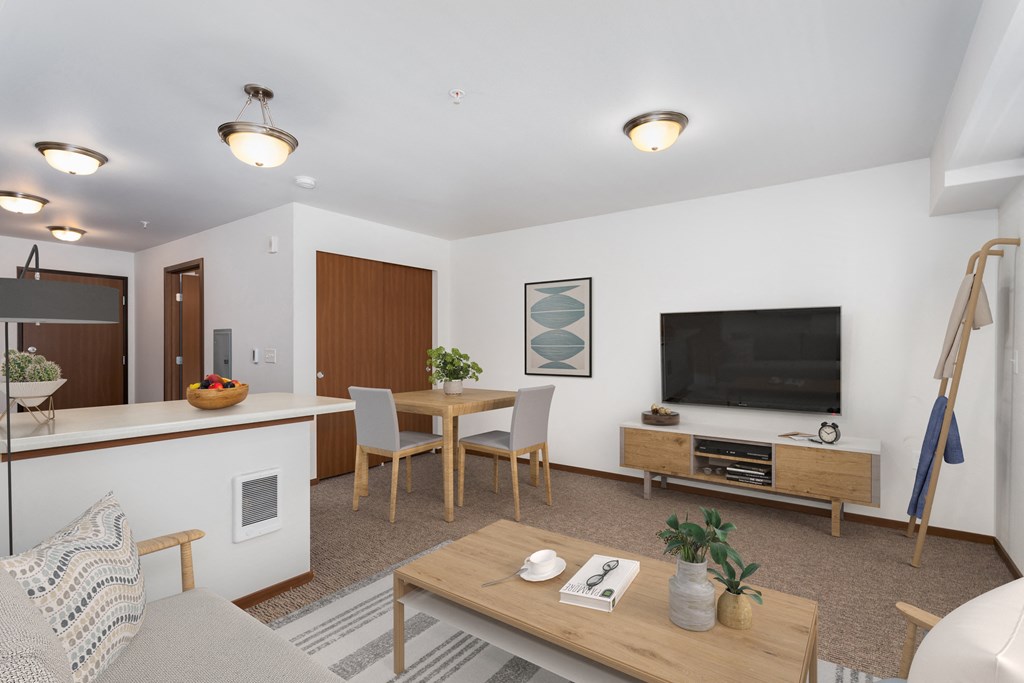 a living room with a table and a television