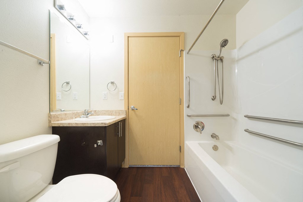 a bathroom with a toilet sink and bathtub