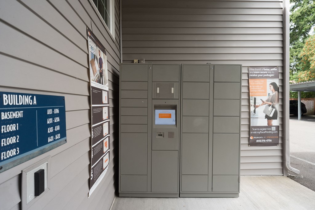 the front of a building with gray lockers and a sign that says building a ras