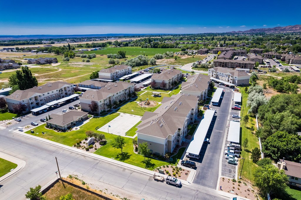 A large, well-maintained apartment complex with multiple buildings and green spaces.