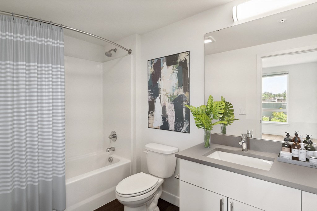 a bathroom with a toilet sink and bathtub