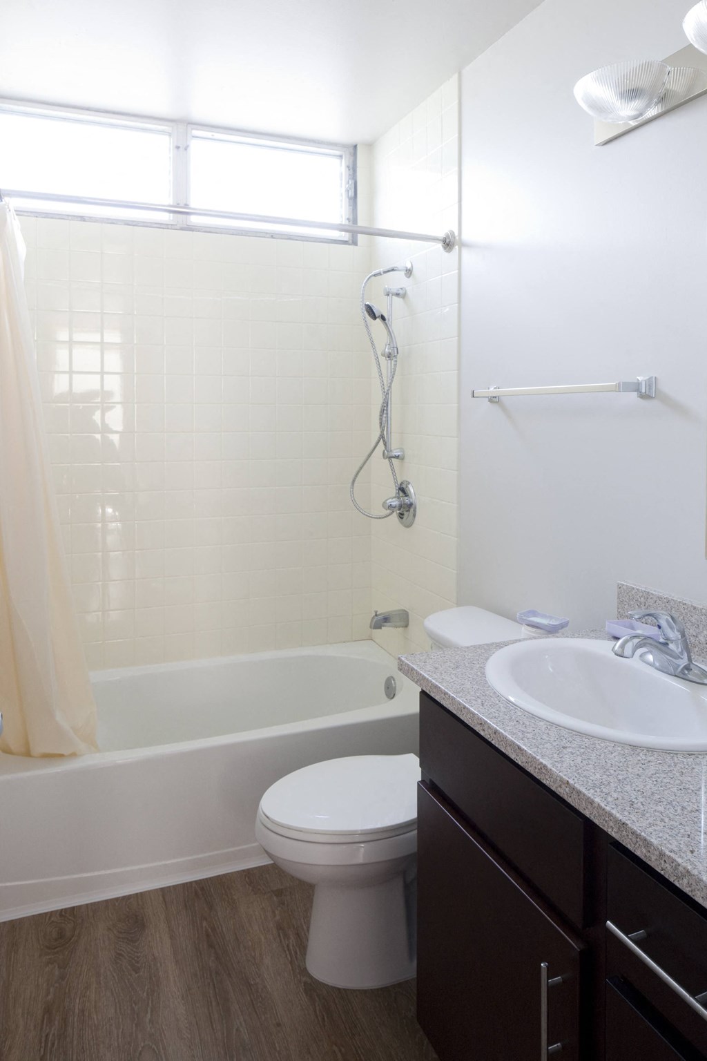 a bathroom with a sink and a toilet and a bath tub