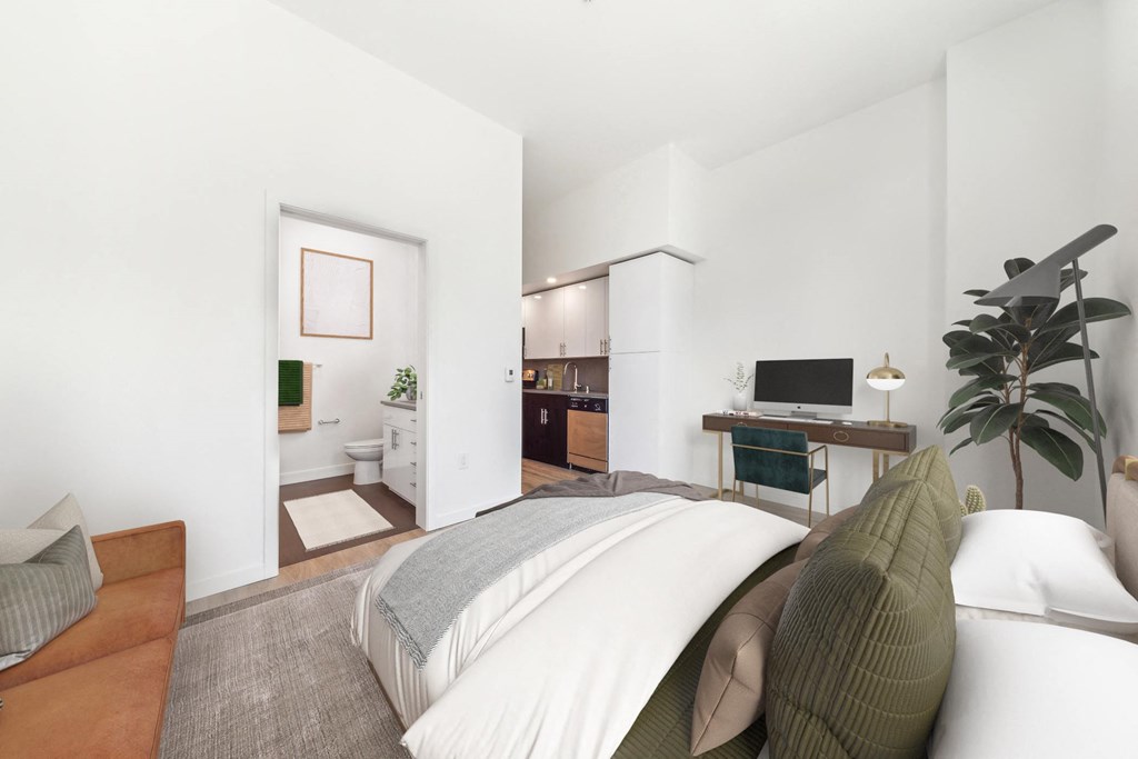 a bedroom with a bed and a bathroom