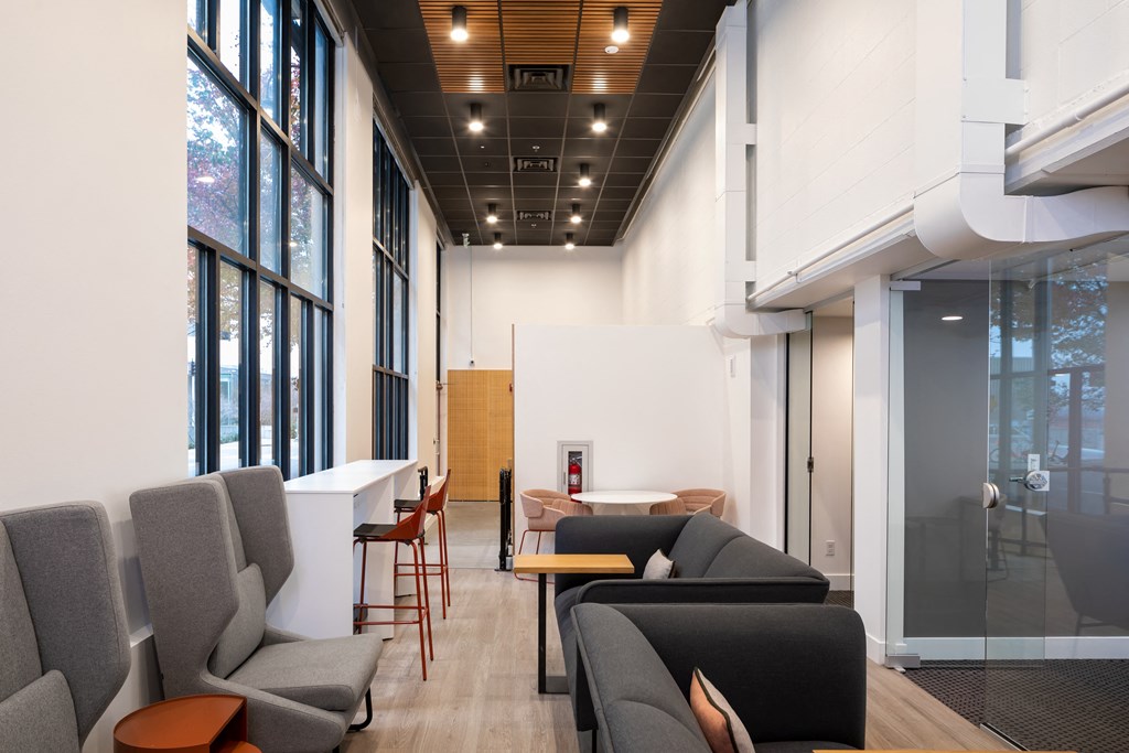 a living room with couches and chairs and a table