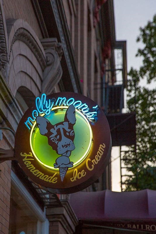 a sign for a restaurant on the side of a building