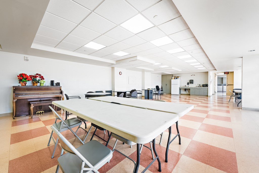 a large room with tables and chairs