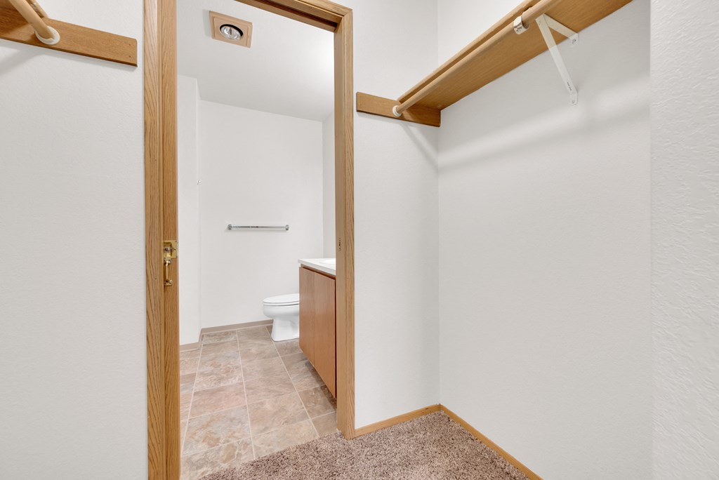 a bathroom with a toilet and a shower in a house