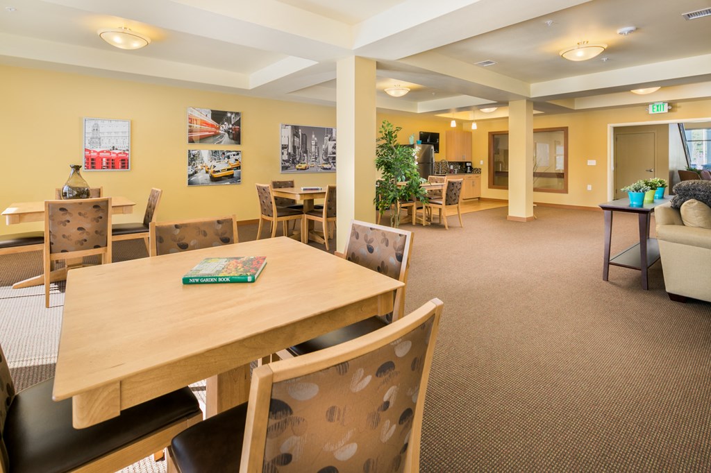 a dining room with tables and chairs and a couch
