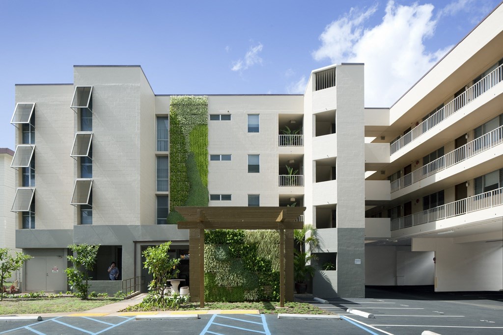 a rendering of the exterior of a building with greenery on it