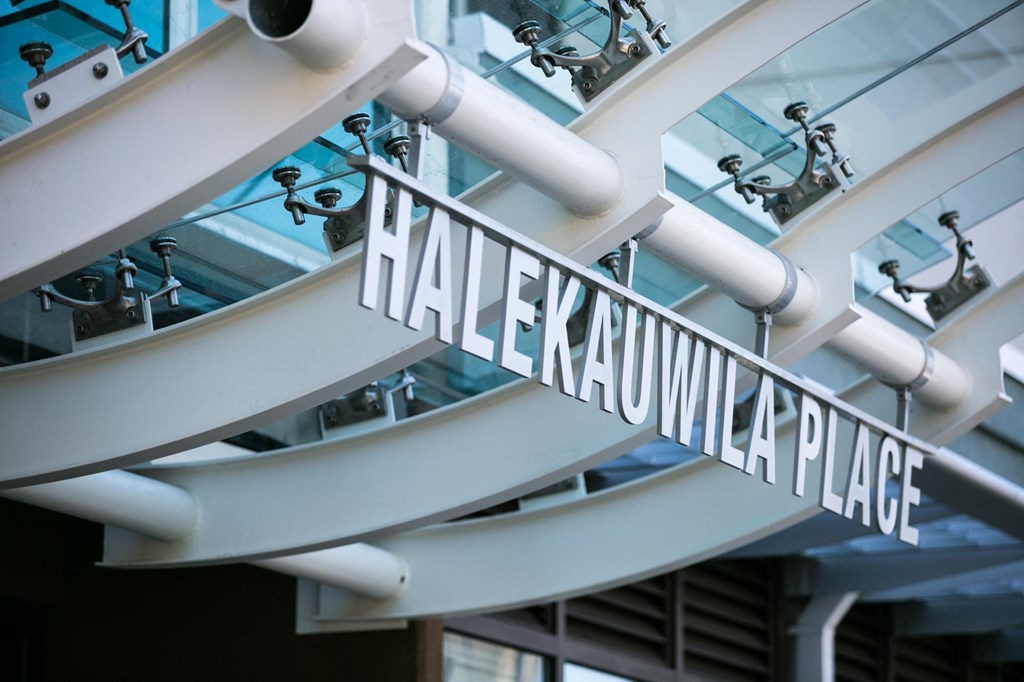 a view of a building with the halekulani place sign